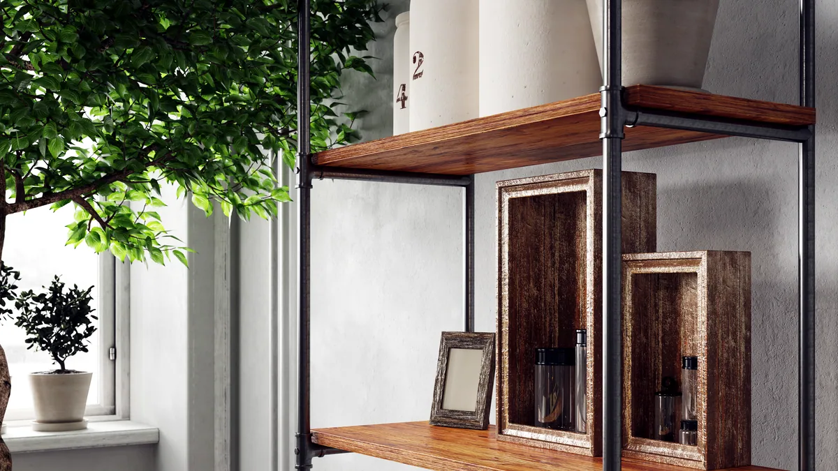 A built-in wardrobe with integrated LED lighting and folded garments on shelves.